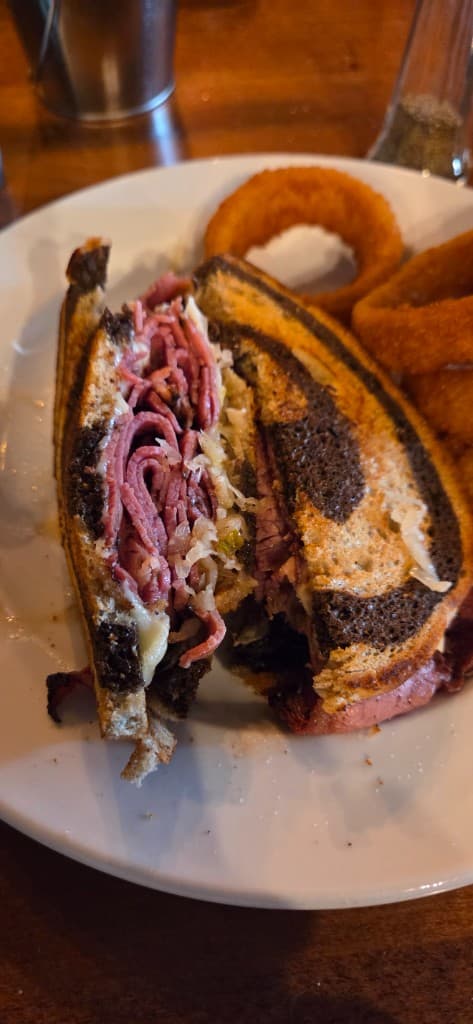 Toasted Reuben sandwich with onion rings