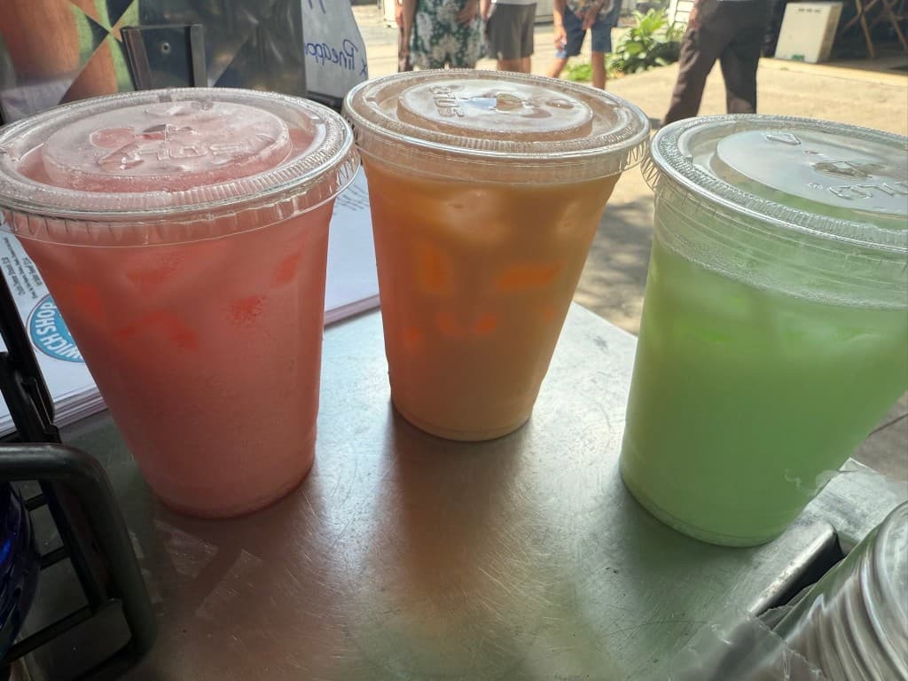 Three colorful dirty sodas on the counter