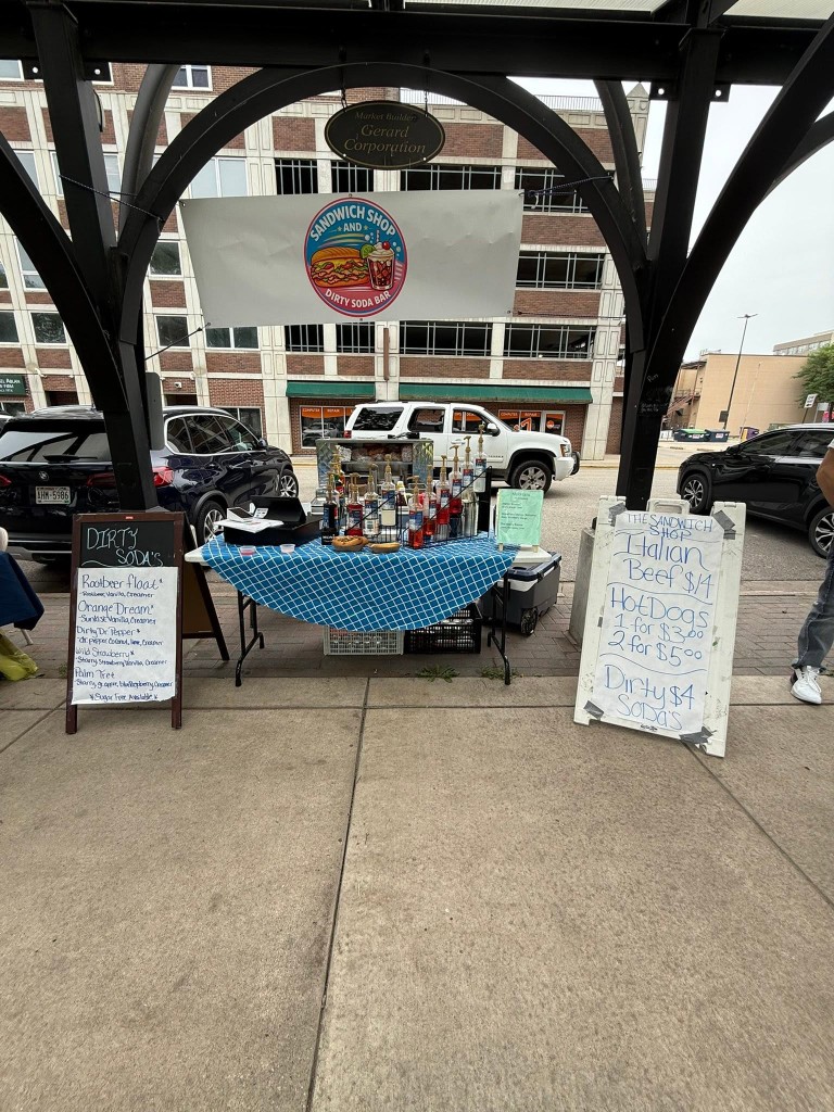 The Sandwich Shop pop-up at a local market with dirty soda chalkboard menu